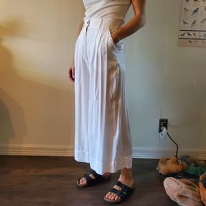Women's white pleated culottes.